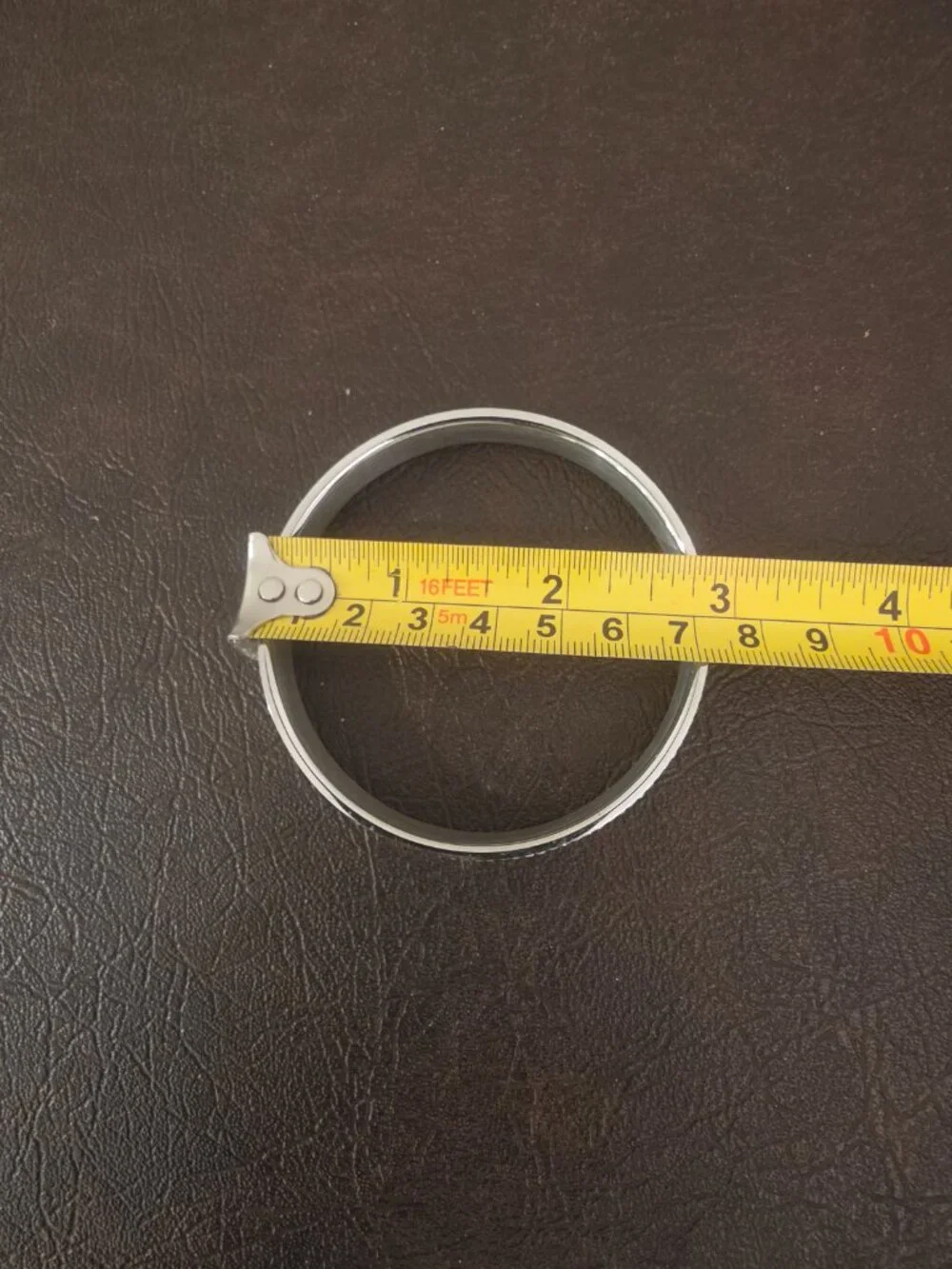 Bracelet bangle features round white/colorless crystal stones